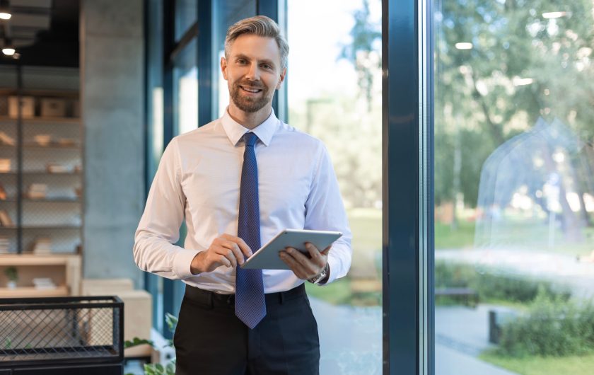 Businessman with tablet in office for schedule, email and financial administration Businessman with tablet in office for schedule, email and financial administration.