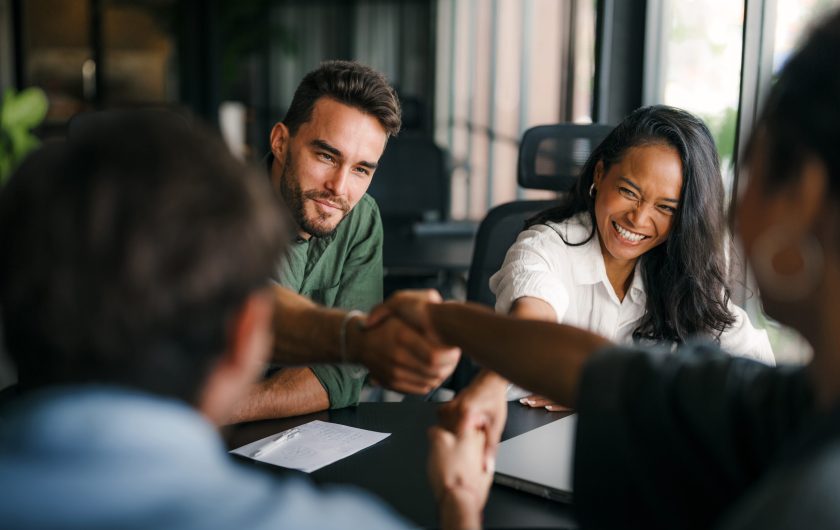 Success diverse group of multiethnic entrepreneurs and business people achieving goals in corporate office